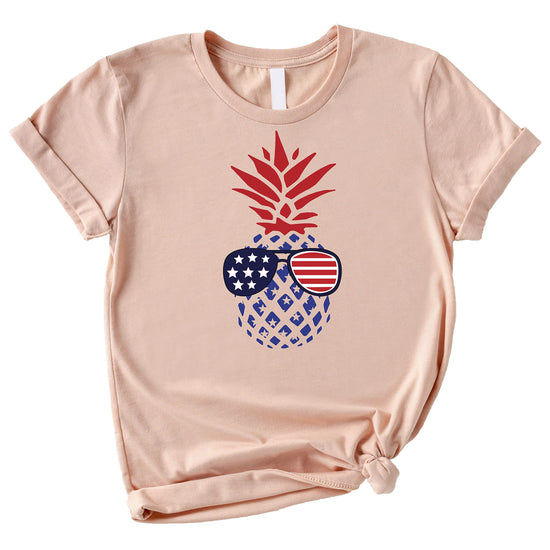 Natural color graphic tee with American flag sunglasses pine design worn for 4th of July