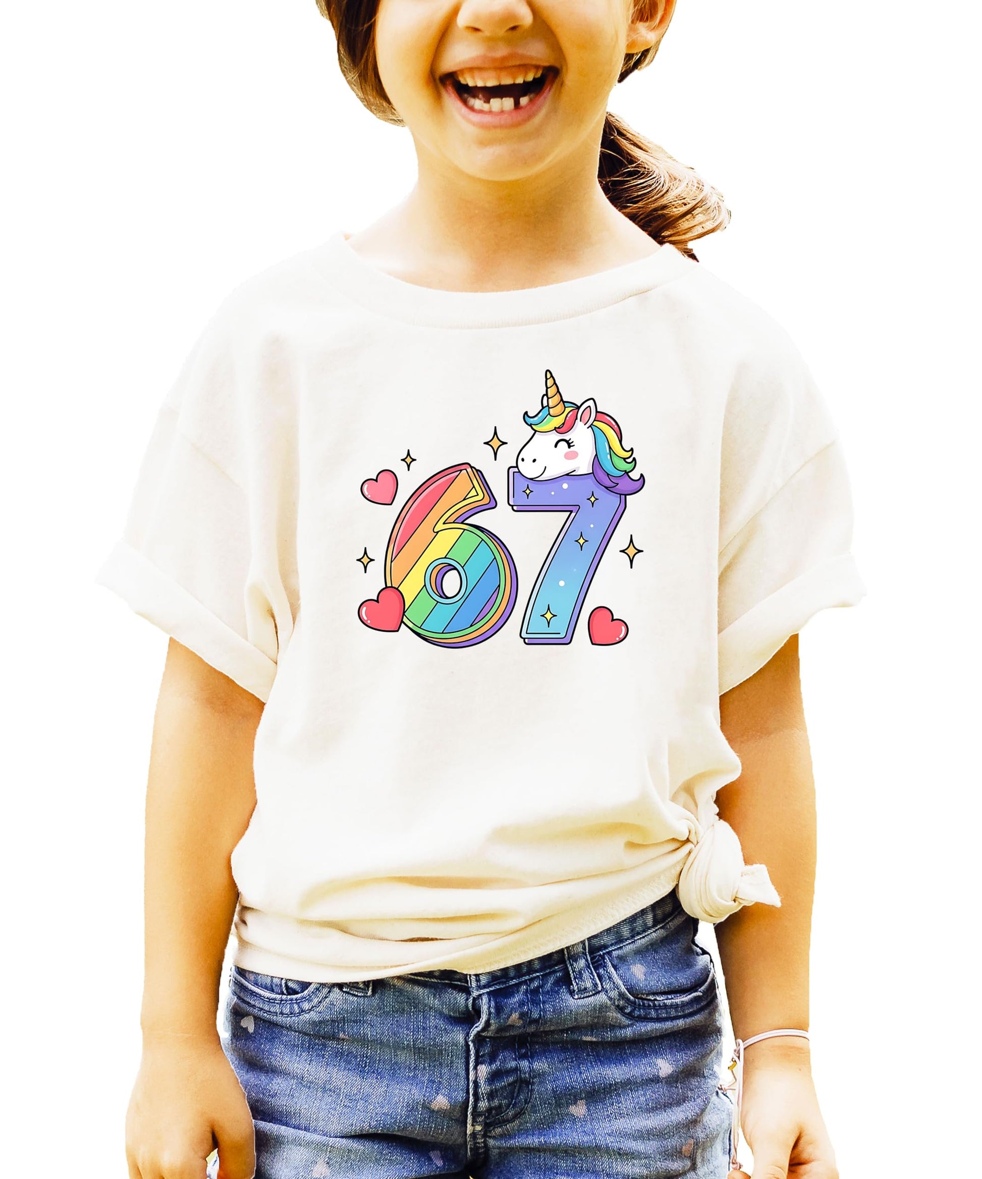 Natural colored unicorn birthday shirt flat lay showing full I Was 6 Now I'm 7 rainbow design