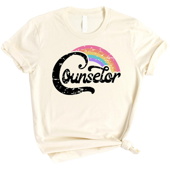 Women's black graphic tee with colorful rainbow counselor design for first and last day of school