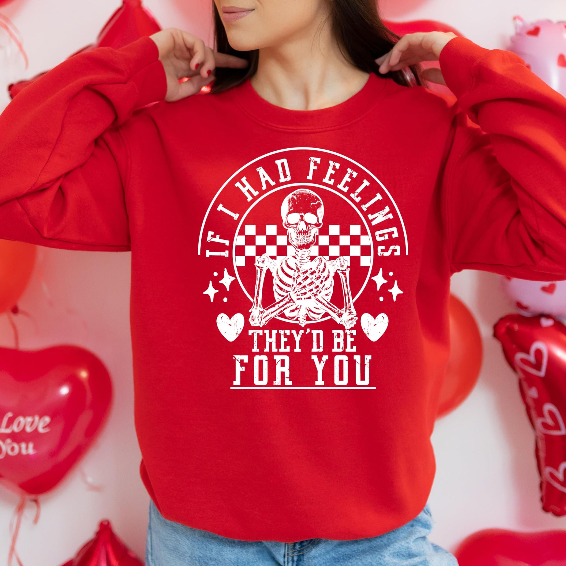 Front view of red Valentine's Day skeleton sweatshirt with humorous graphic print by Olive Loves Apple
