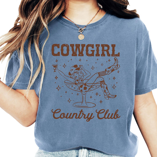 Cowgirl Country Club shirt with retro cowgirl in cocktail glass design on blue denim tee