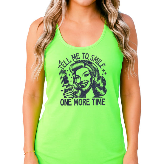 Close-up of Tell Me to Smile slogan graphic print on women's sleeveless tank top