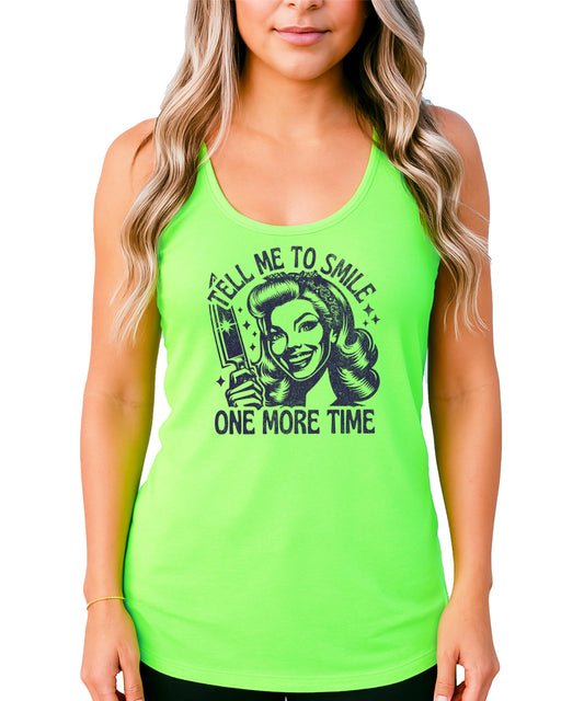 Close-up of Tell Me to Smile slogan graphic print on women's sleeveless tank top