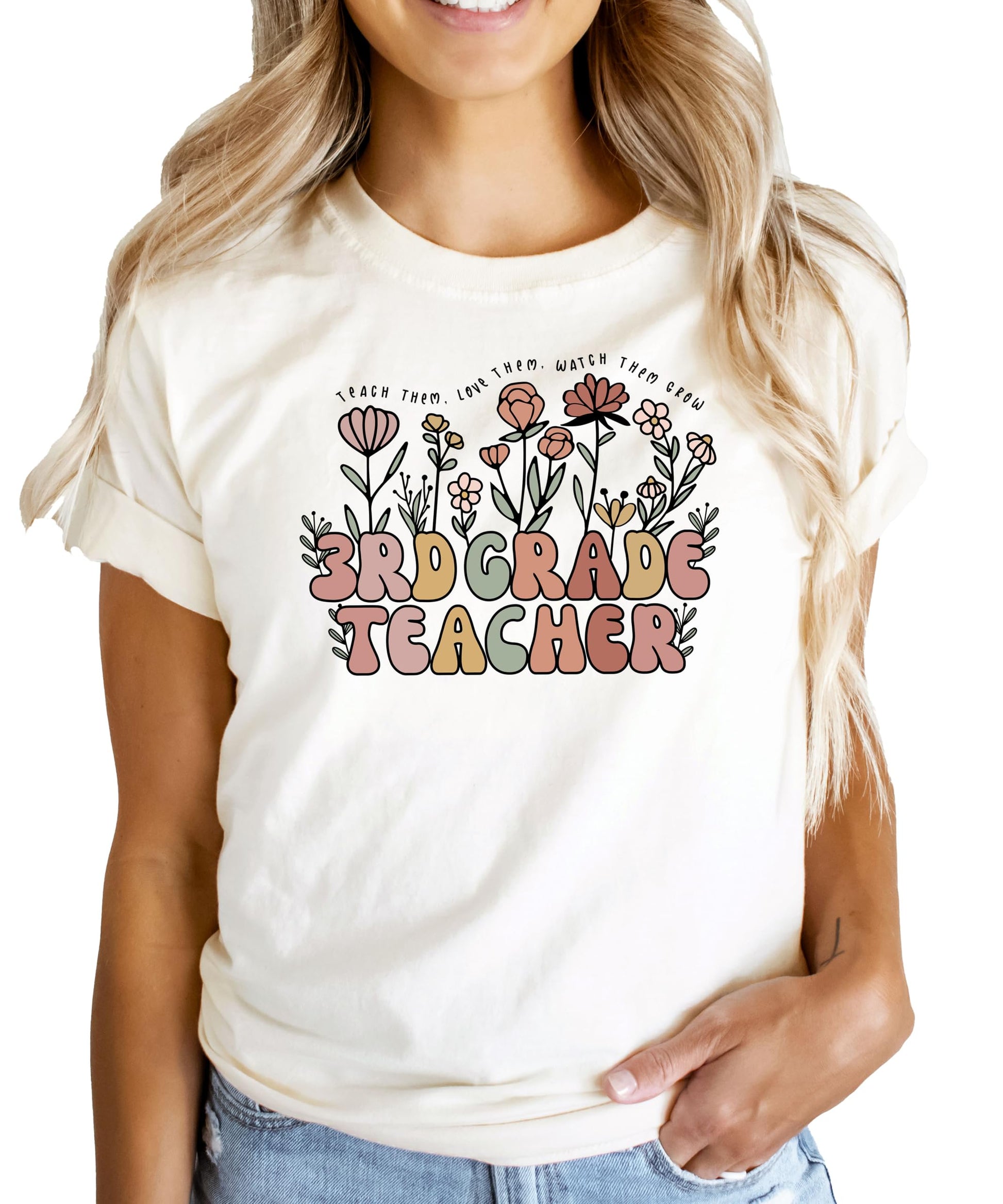 Front view of peach women's 3rd grade teacher shirt with flower garden graphic design