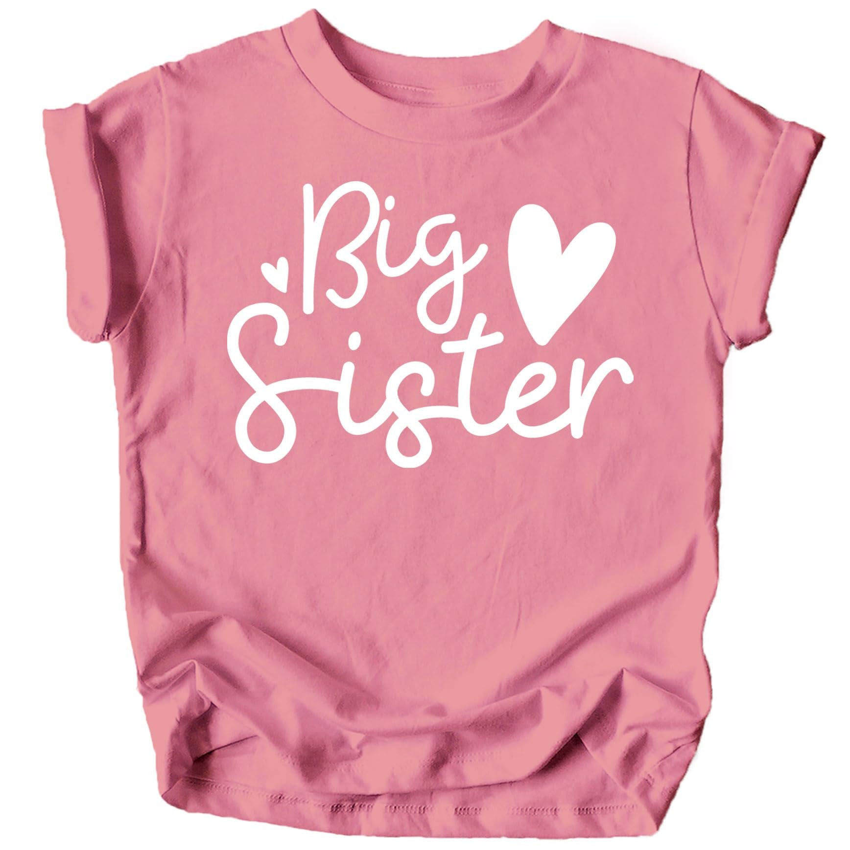 Toddler girl wearing pink Big Sister Hearts sibling reveal shirt from Olive Loves Apple