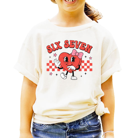Front view of funny six seven Valentine's heart kids t-shirt with checkered graphic design