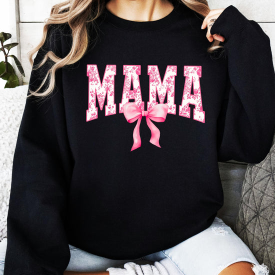 Detail shot of soft black sweatshirt fabric with pink bow MAMA print