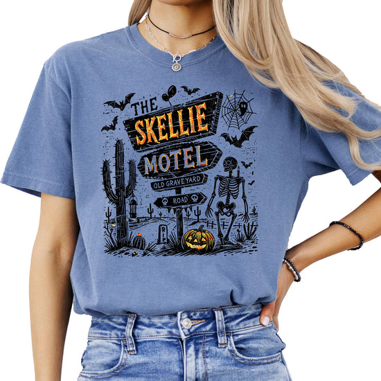 Back or side view of Skellie Motel spooky skeleton Halloween shirt in seafoam color