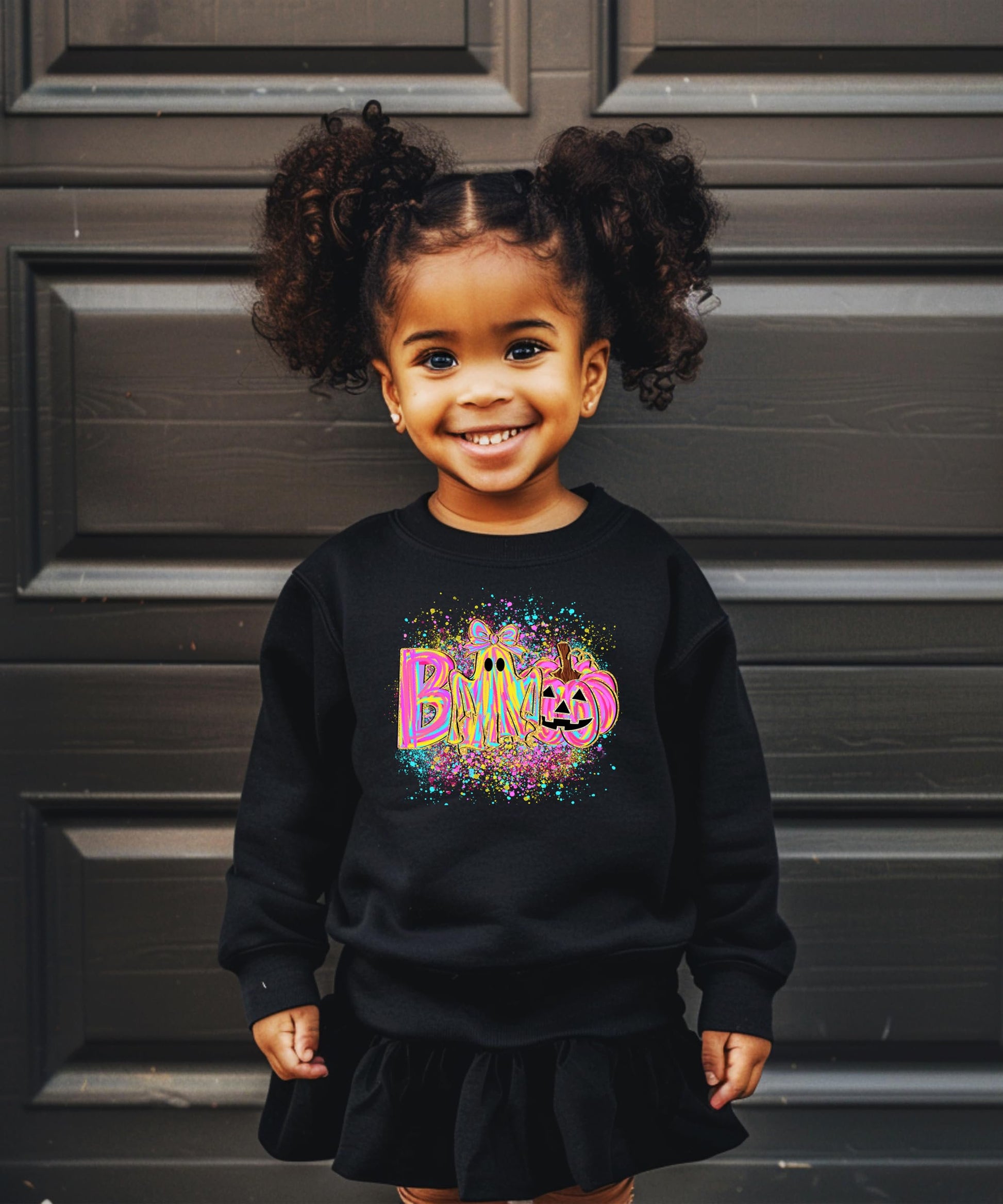 Kids or teen wearing neon BOO Halloween ghost sweatshirt perfect for trick-or-treating