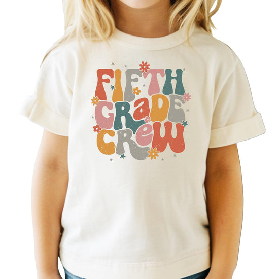 Model wearing peach second grade retro school shirt front view