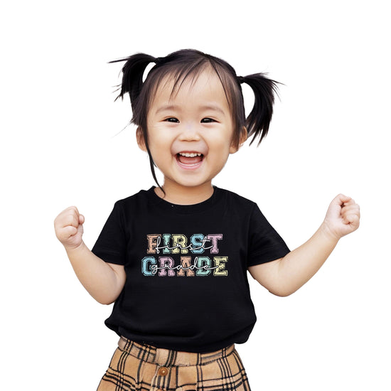 Girls first grade t-shirt with colorful bold pastel letter font, perfect for back to school
