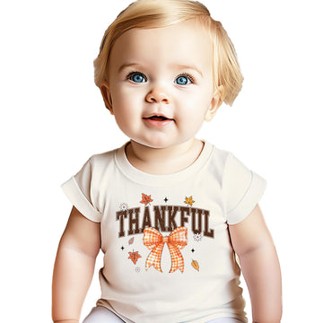 Orange Thankful shirt with gingham bow and autumn leaf design for toddlers and girls