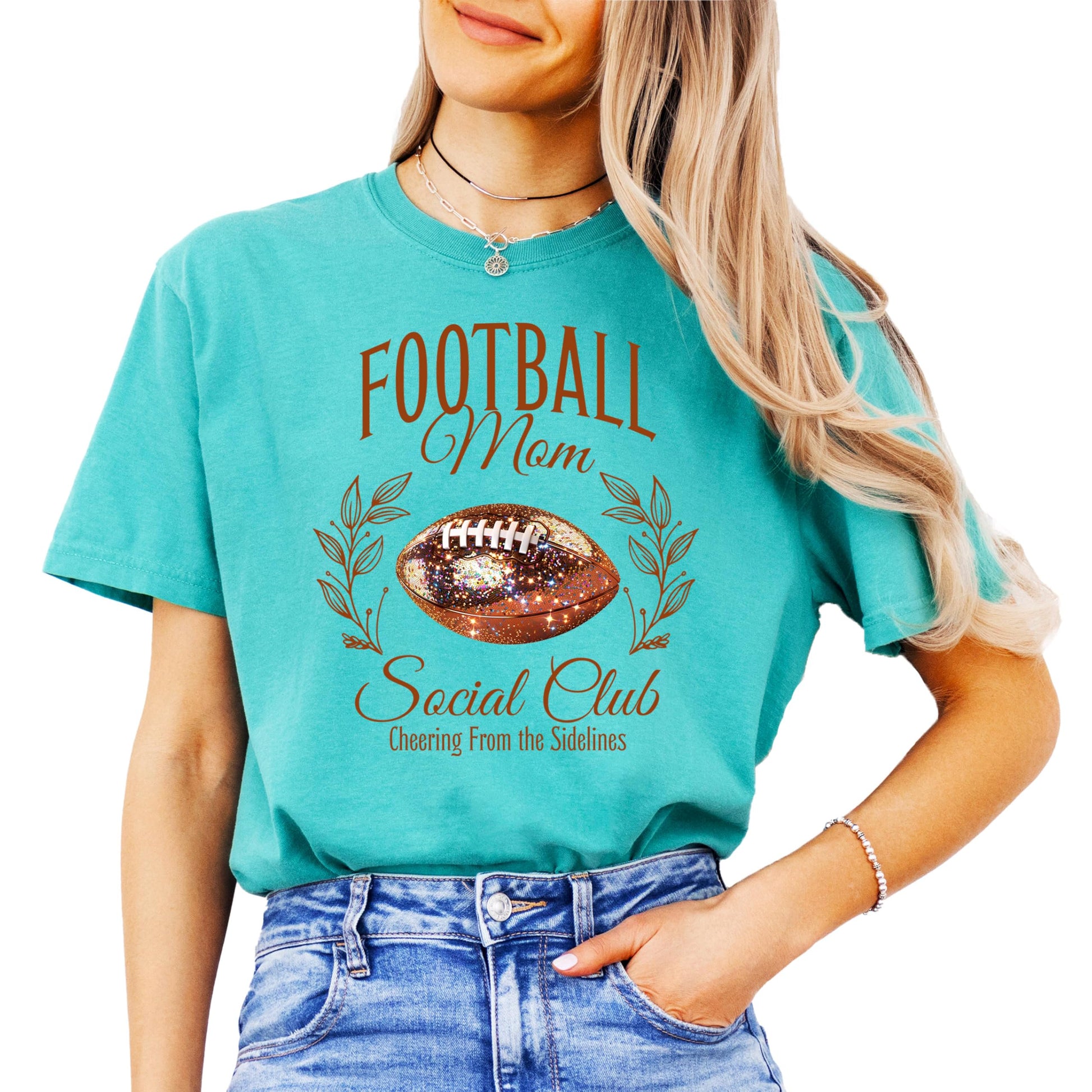 Side or back view of Football Mom Social Club oversized graphic tee in seafoam