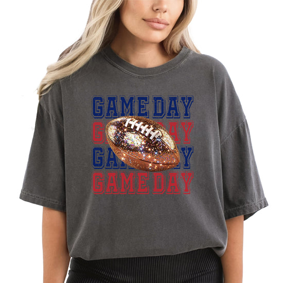 Close-up of faux glitter Game Day graphic in red and blue on women's football pullover shirt