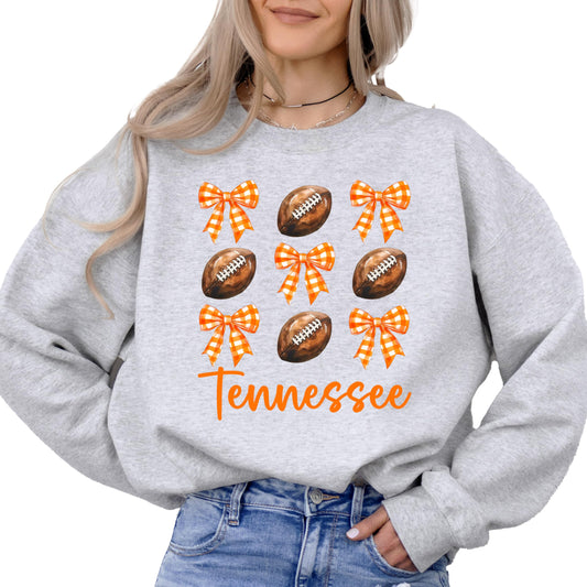 Gray Tennessee football sweatshirt with orange bows and football graphics for women