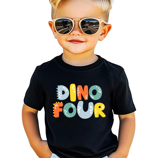 Flat lay of kids' dinosaur birthday shirt in royal blue with bold dino design