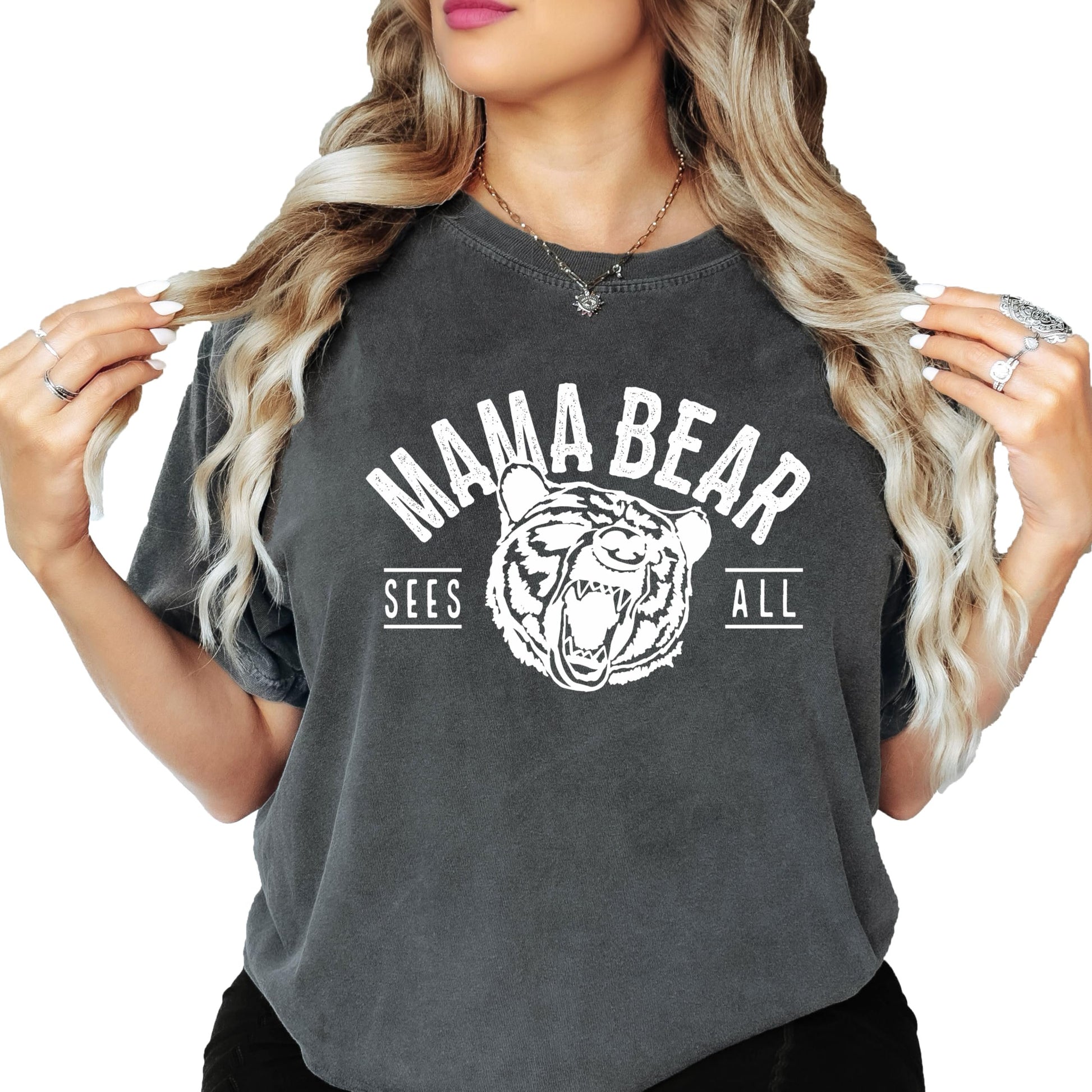 Close-up of Mama Bear Sees All bold graphic print on women's casual tee