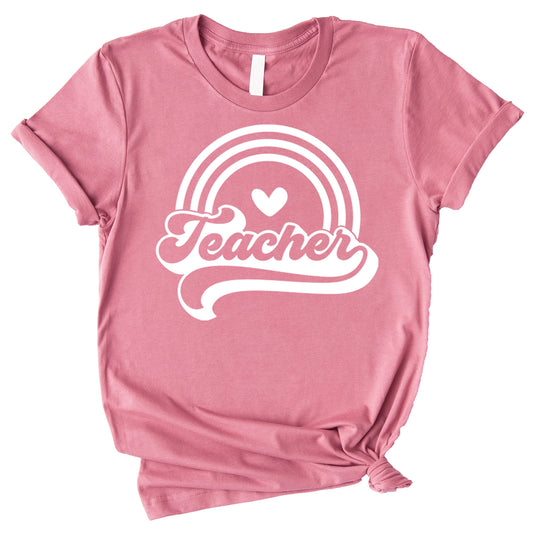 Close-up of retro rainbow teacher shirt design with vibrant colorful print