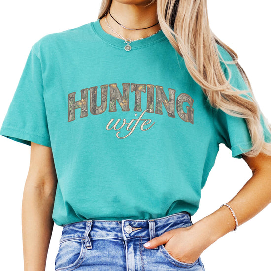 Lifestyle shot of women's hunting wife camo graphic tee for country outdoor style