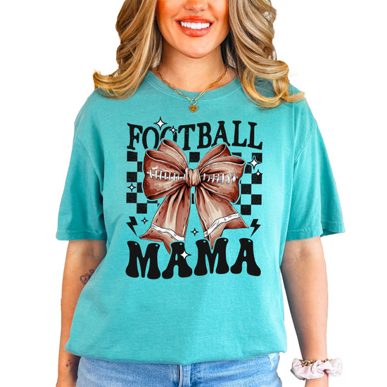 Women's ivory Football Mama shirt with girly bow graphic laid flat