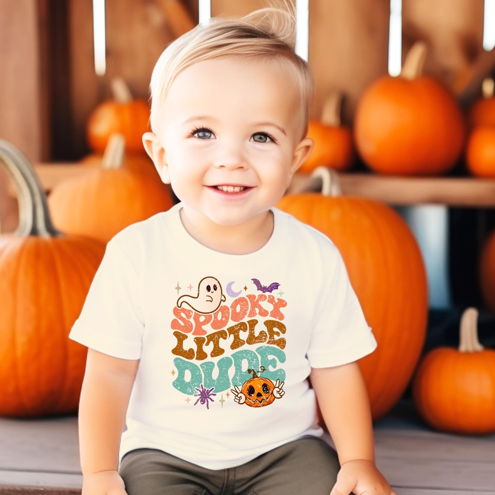 Flat lay of groovy Halloween shirt for baby and toddler boys by Olive Loves Apple