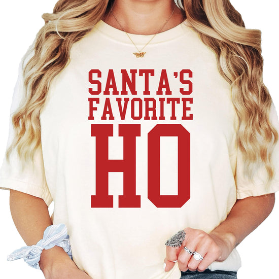 Women's Christmas humor tee with Santa's Favorite Ho text graphic
