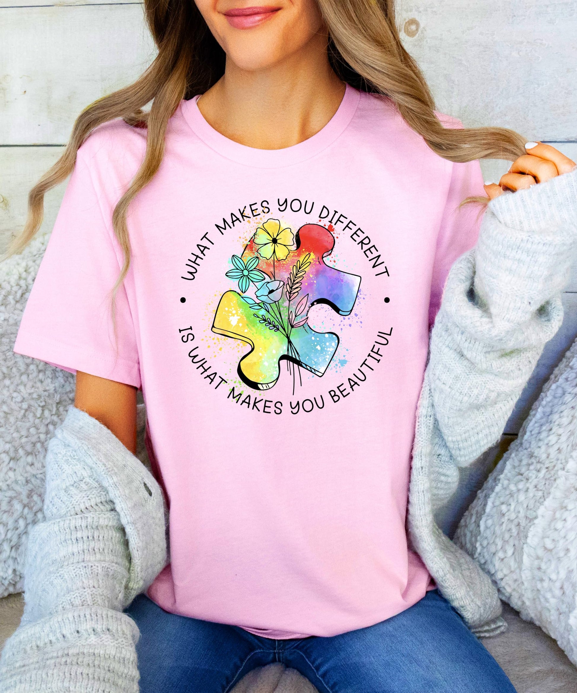 Detail shot of What Makes You Different text with colorful puzzle piece graphics