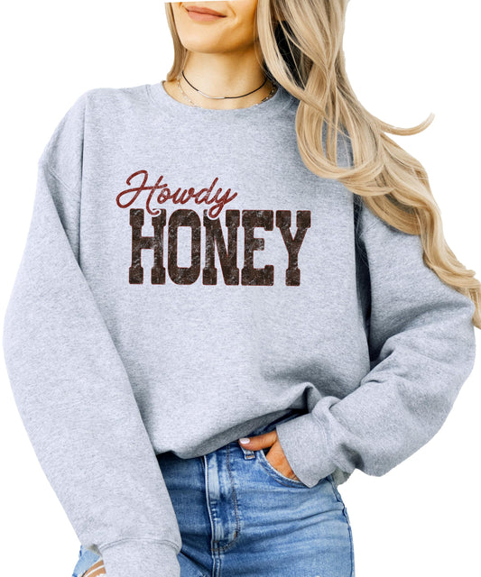 Close-up of Howdy Honey graphic print on green women's western sweatshirt showing bold vintage-style text