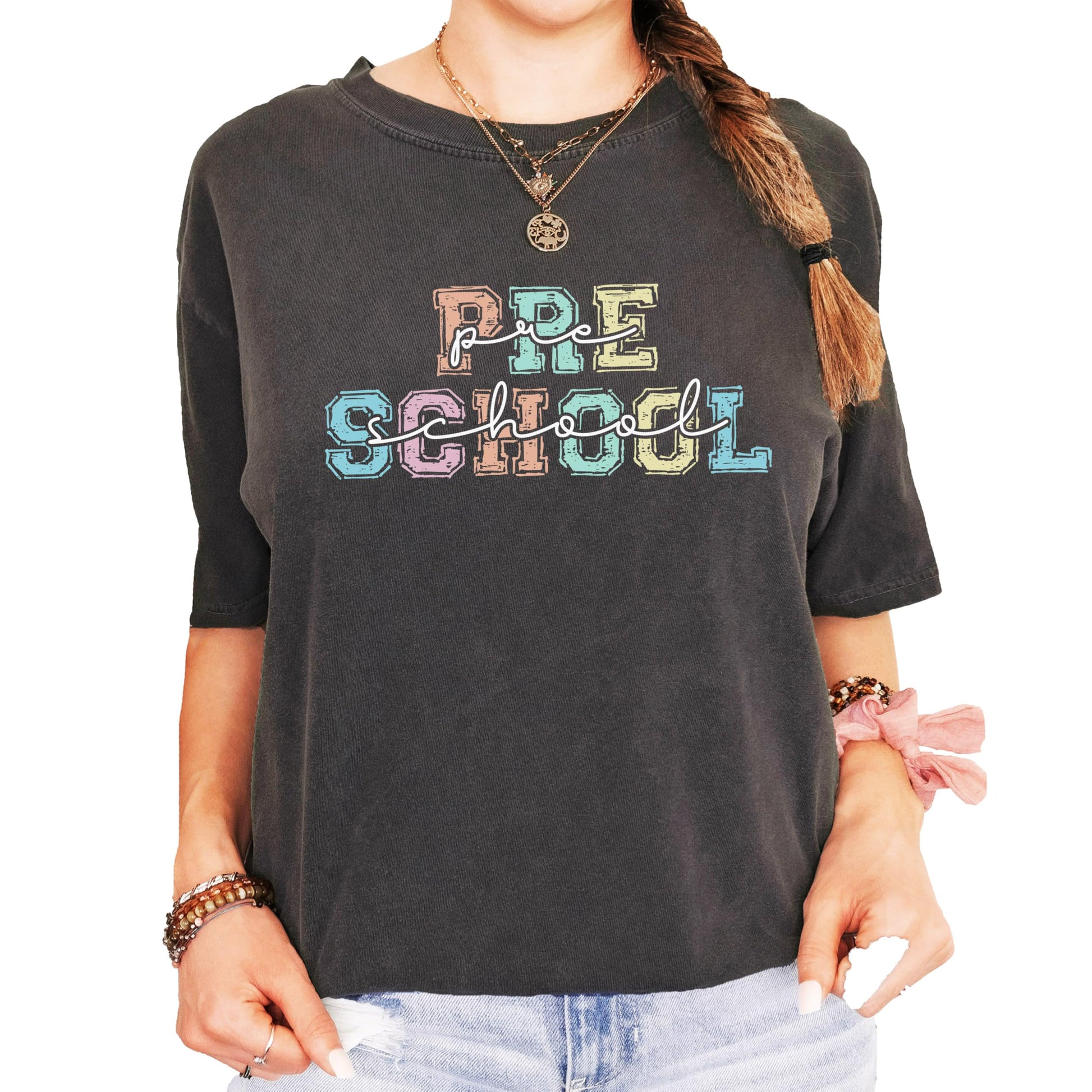 Preschool teacher women's graphic tee laid flat showing vibrant colorful font design