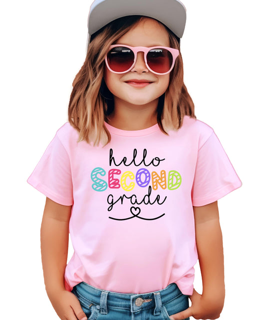 Front view of Hello 2nd Grade pink kids shirt with colorful back to school graphic design