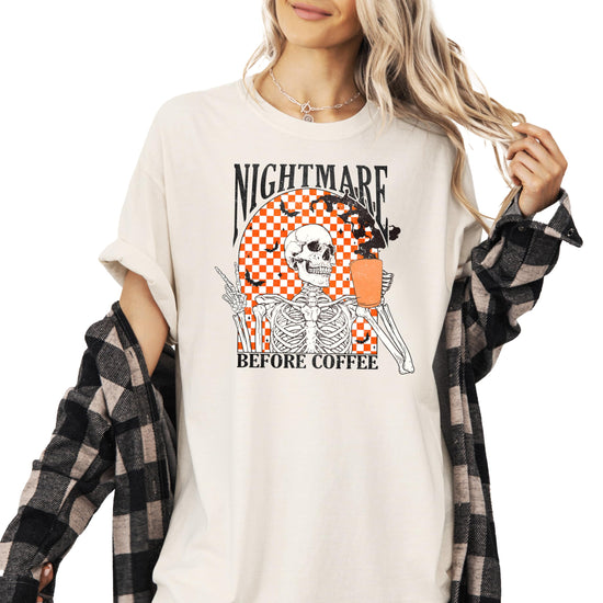 Nightmare Before Coffee seafoam Halloween t-shirt with retro skeleton and bats graphic for women and teens