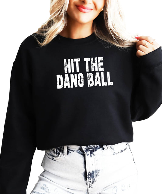 Front view of Hit The Dang Ball distressed graphic pullover sweatshirt in red for women and teens