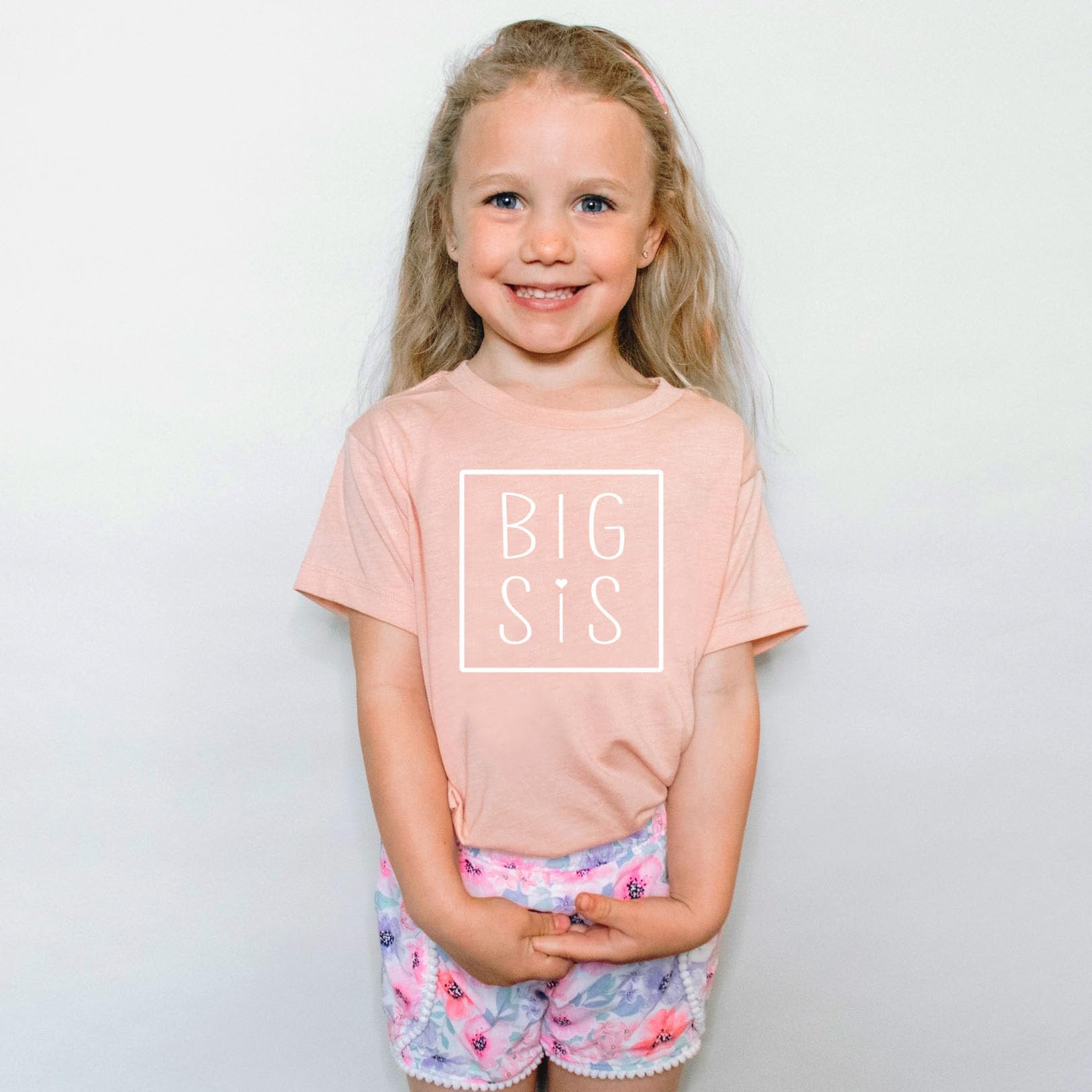Big Sis square sibling reveal shirt detail view on purple toddler graphic tee