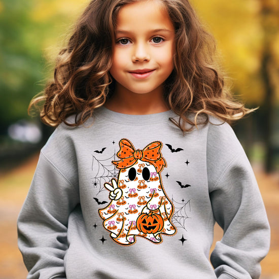 Detail shot of print quality on girly ghost orange bow kids Halloween sweatshirt