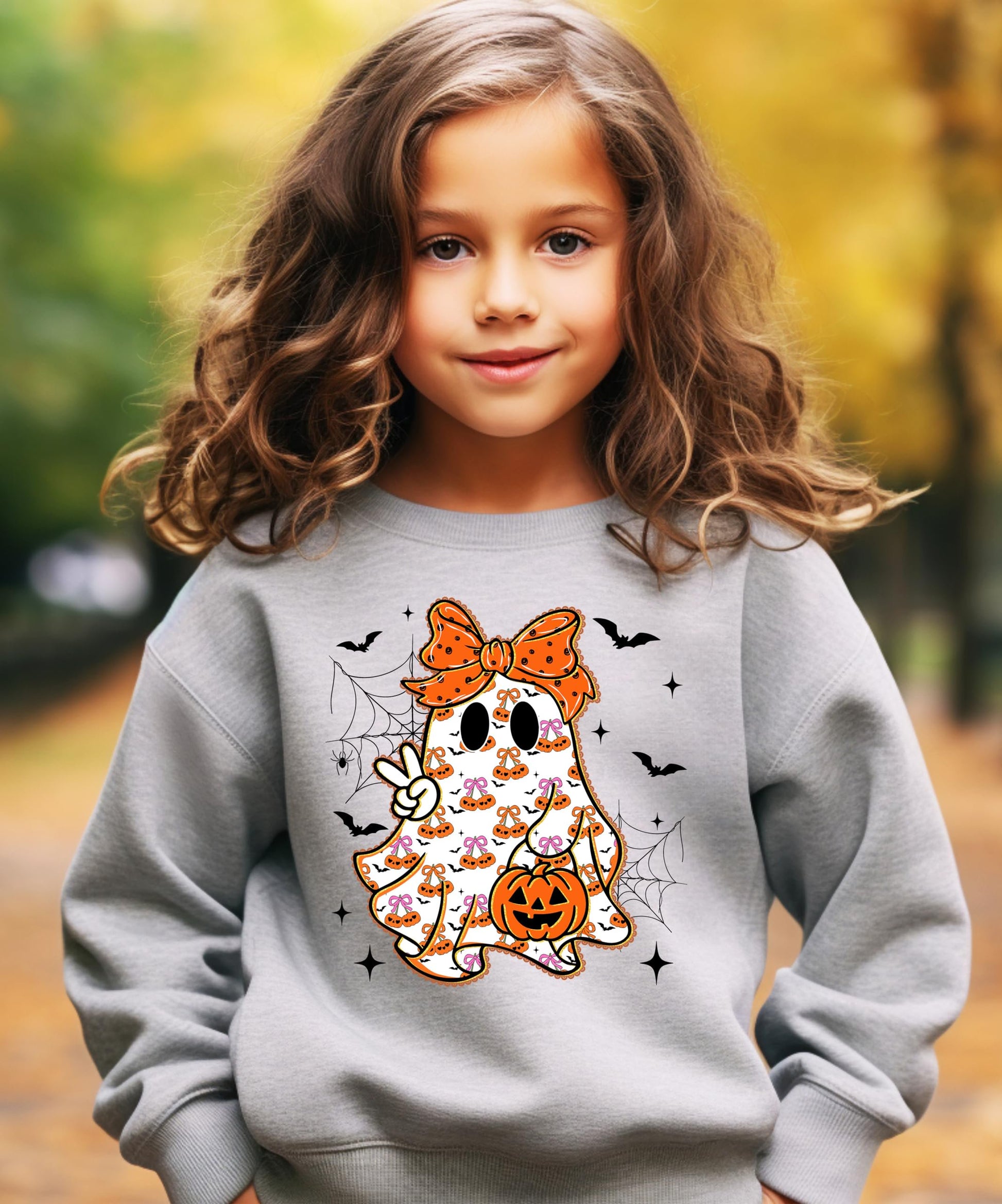 Detail shot of print quality on girly ghost orange bow kids Halloween sweatshirt
