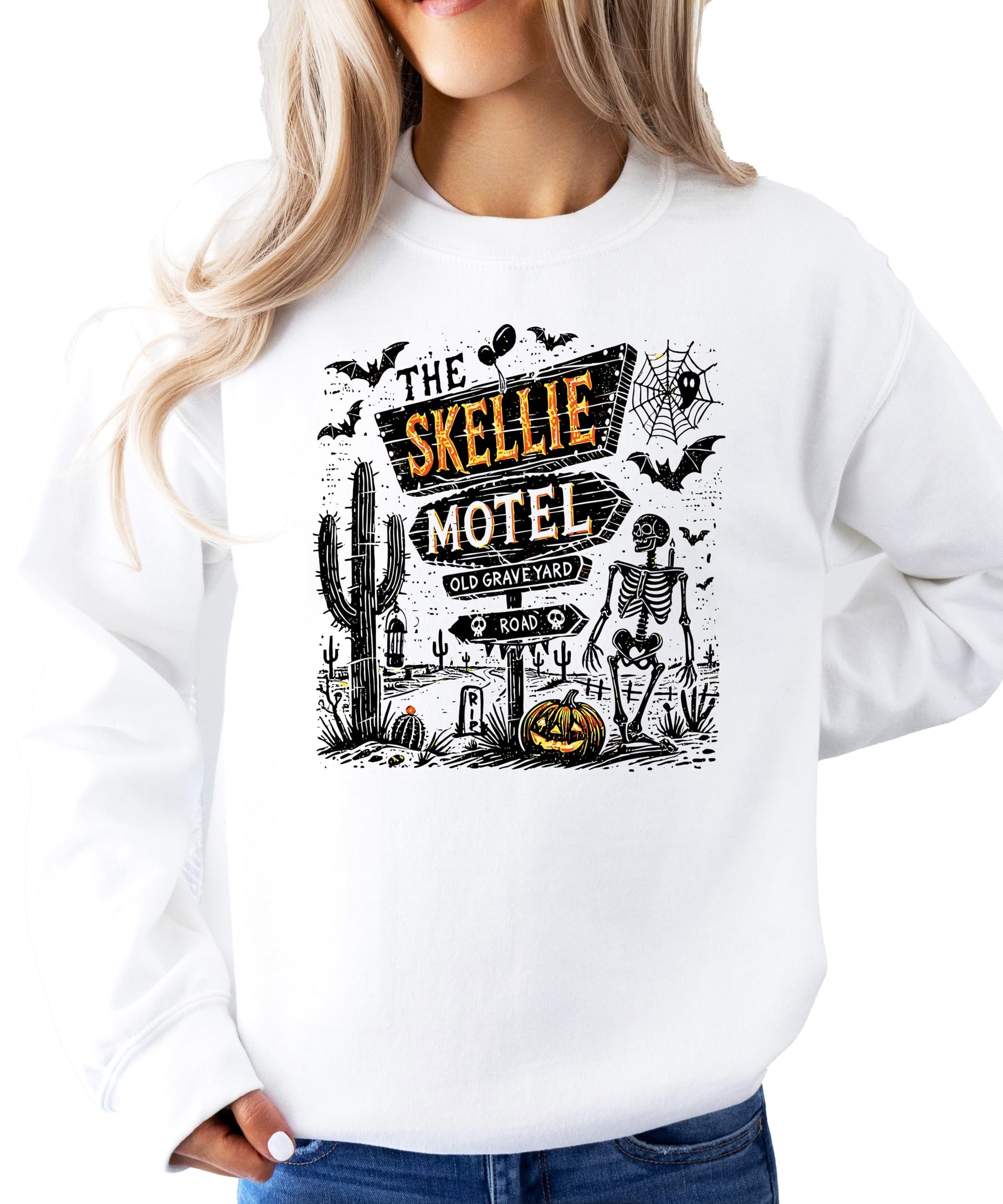 Flat lay of The Skellie Hotel Halloween sweatshirt for women men and youth by Olive Loves Apple
