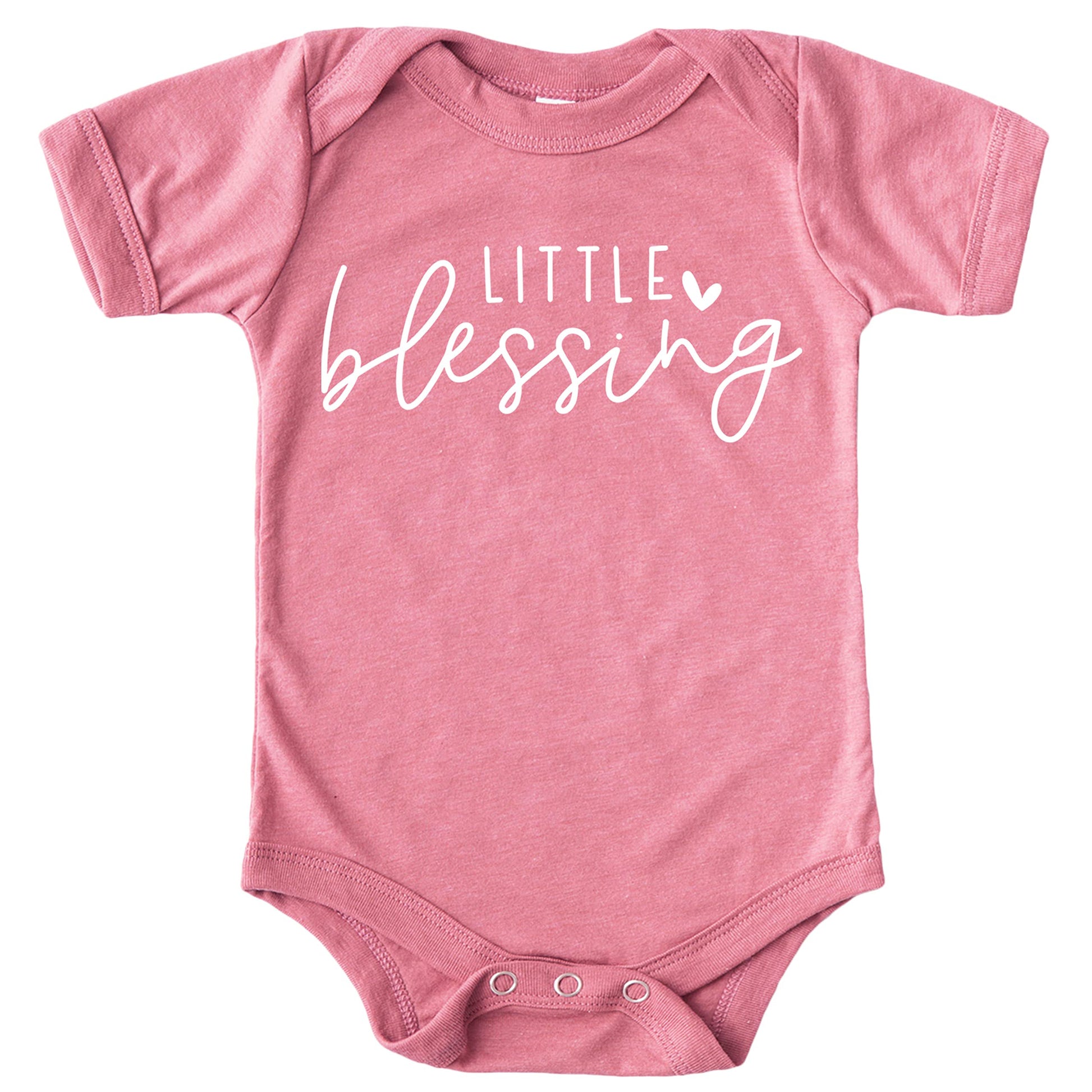 Peach newborn baby girl bodysuit with white Little Blessing heart graphic, laid flat