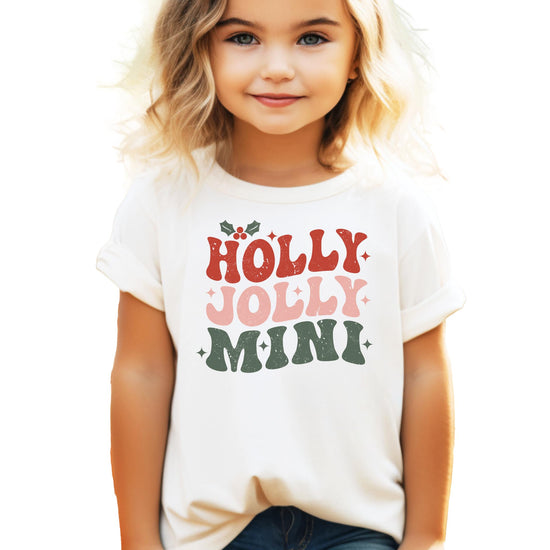 Holly Jolly Mistletoe mama and mini matching Christmas tees displayed together for family outfit inspo