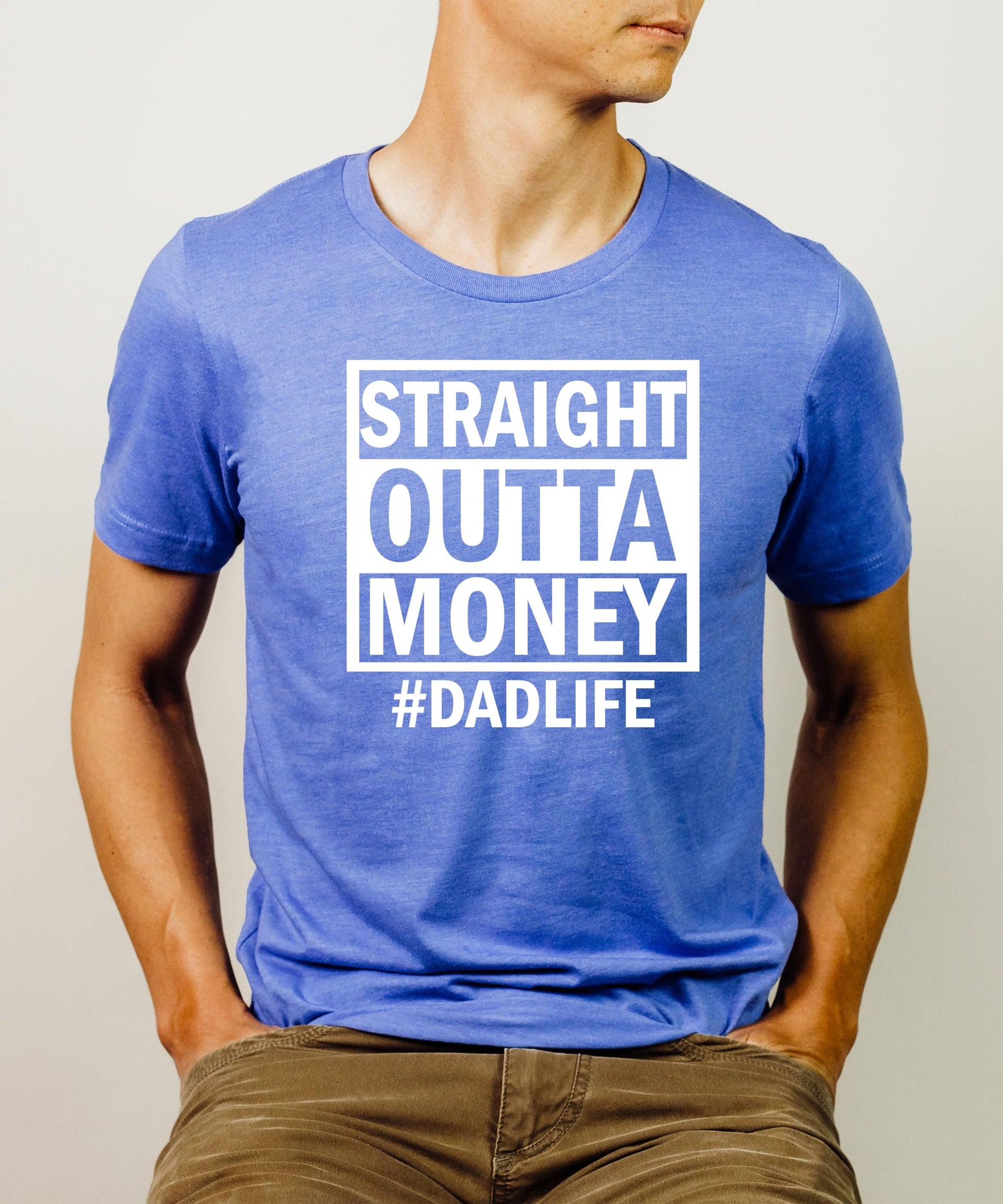 Flat lay of royal blue Straight Outta Money men's graphic tee