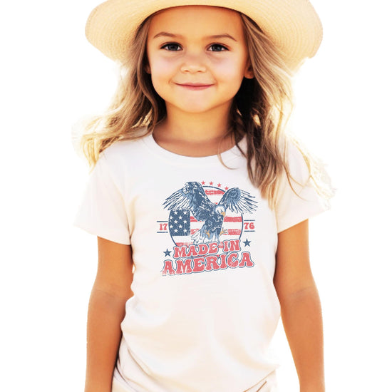 Made In America 1776 patriotic graphic tee with vintage eagle and American flag design on natural shirt