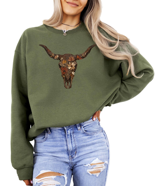 Women's army green sweatshirt featuring a vintage longhorn skull with rustic floral detail by Olive Loves Apple