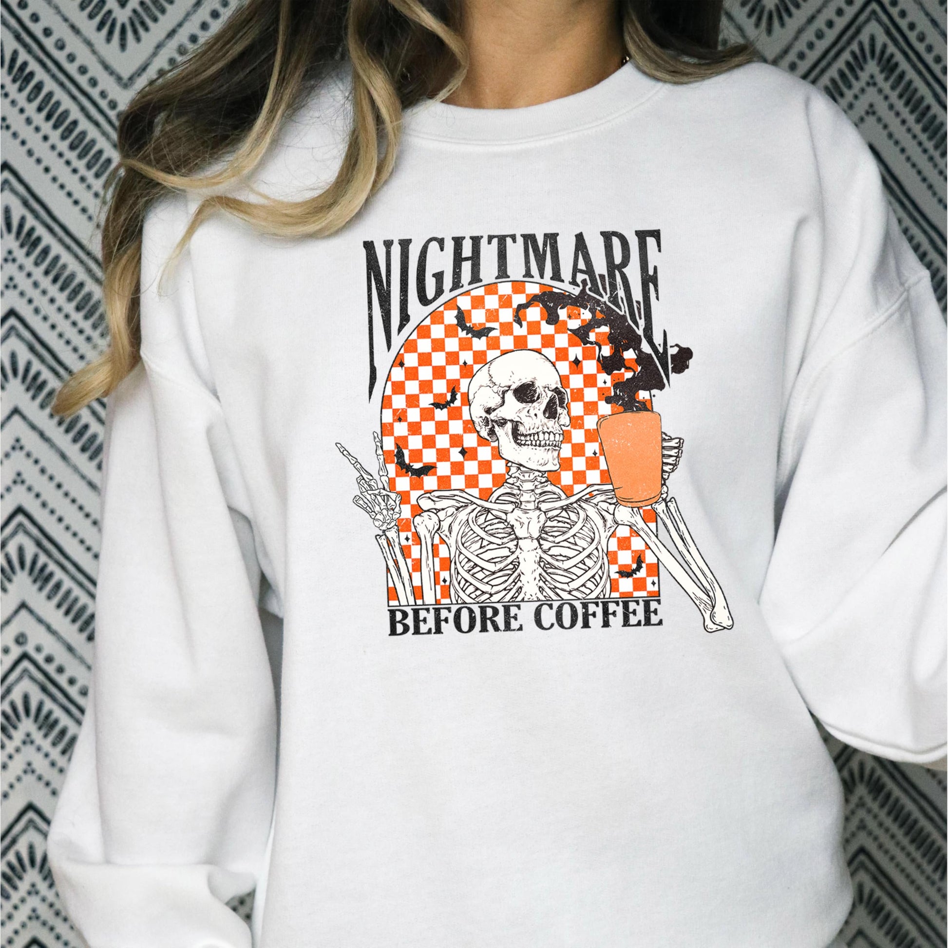 Detail shot of professional printed skeleton graphic on gray Halloween sweatshirt