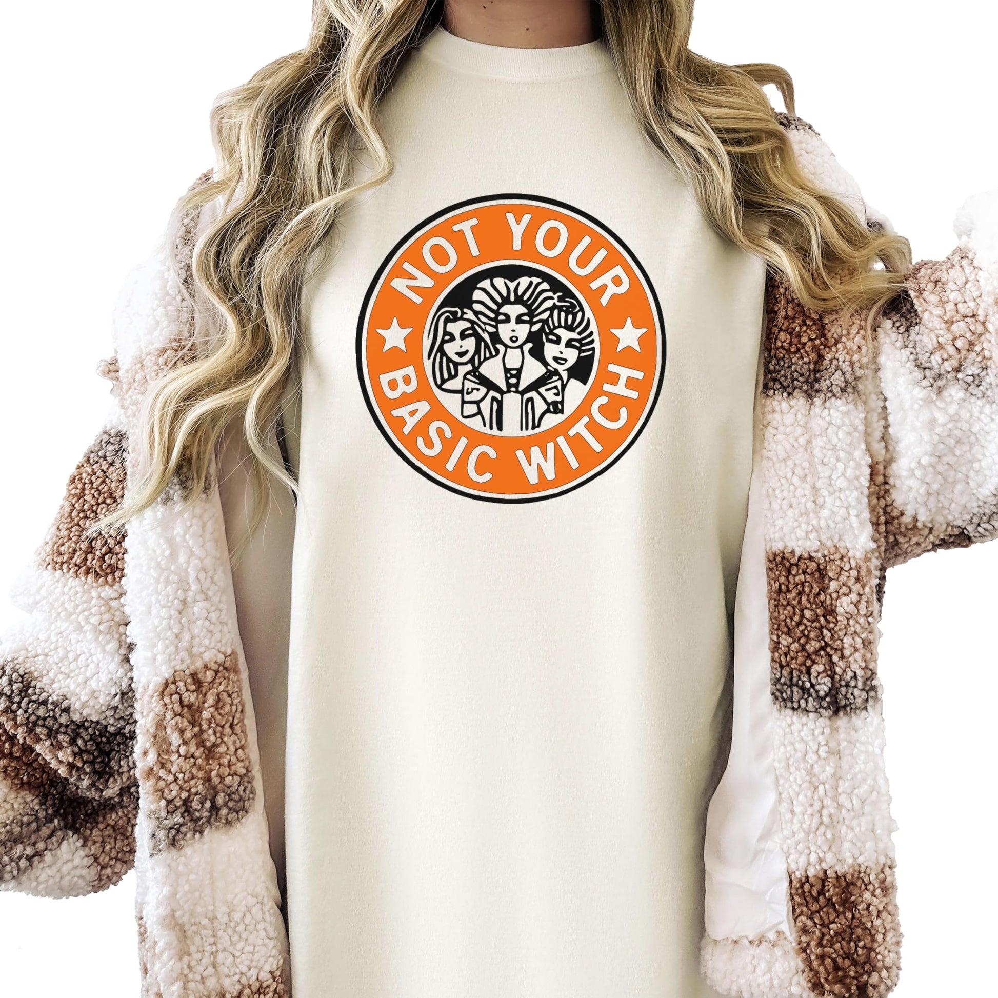 Front view of Not Your Basic Witch funny fall Halloween tee in ivory with bold graphic print