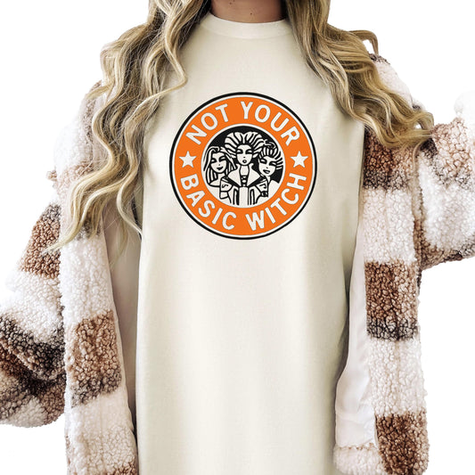Front view of Not Your Basic Witch funny fall Halloween tee in ivory with bold graphic print