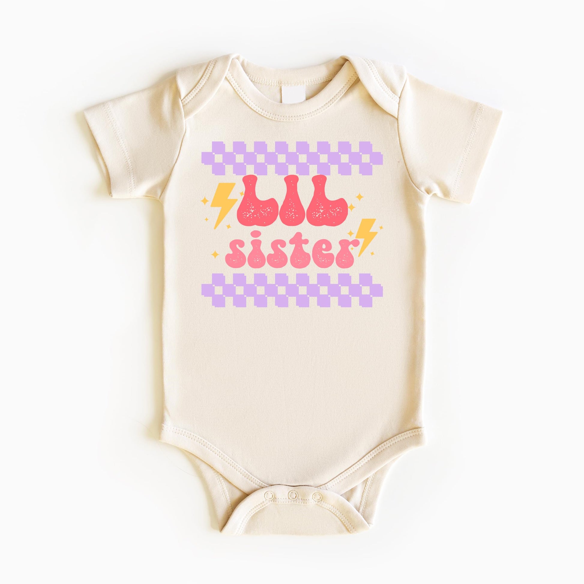 Little sister shirt and bodysuit set laid flat showing retro lightning design