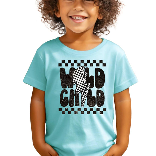 Close-up of Wild Child retro lettering and checkerboard pattern graphic on boys t-shirt