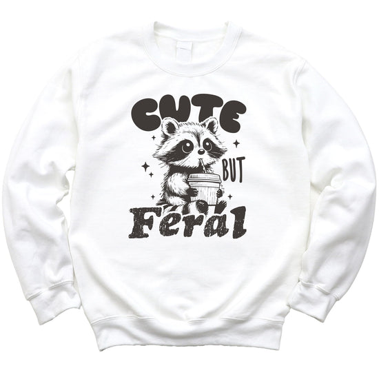 Toddler-sized Cute But Feral raccoon sweatshirt laid flat showing full graphic