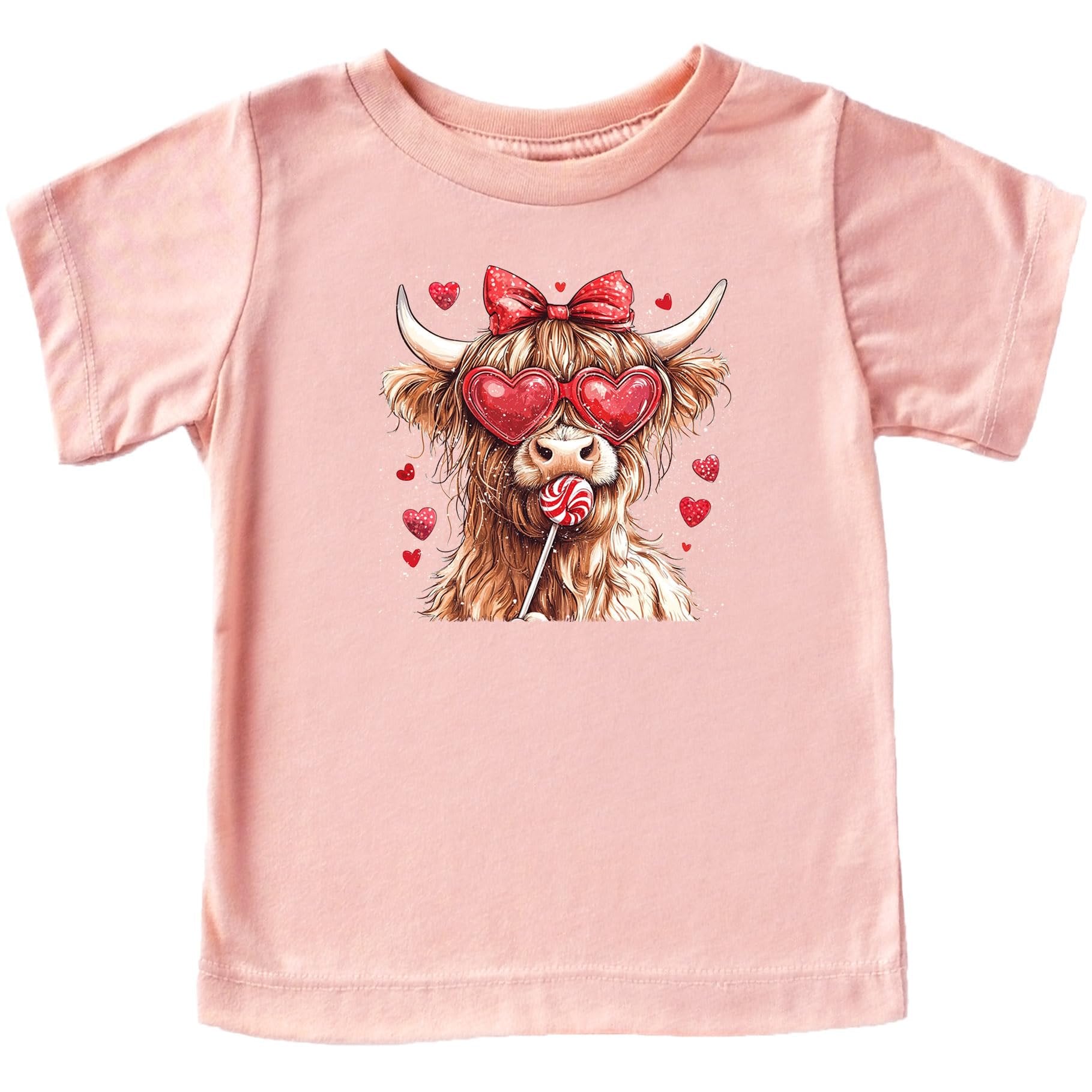 Young girl wearing cute pink Highland cow Valentine's Day graphic tee