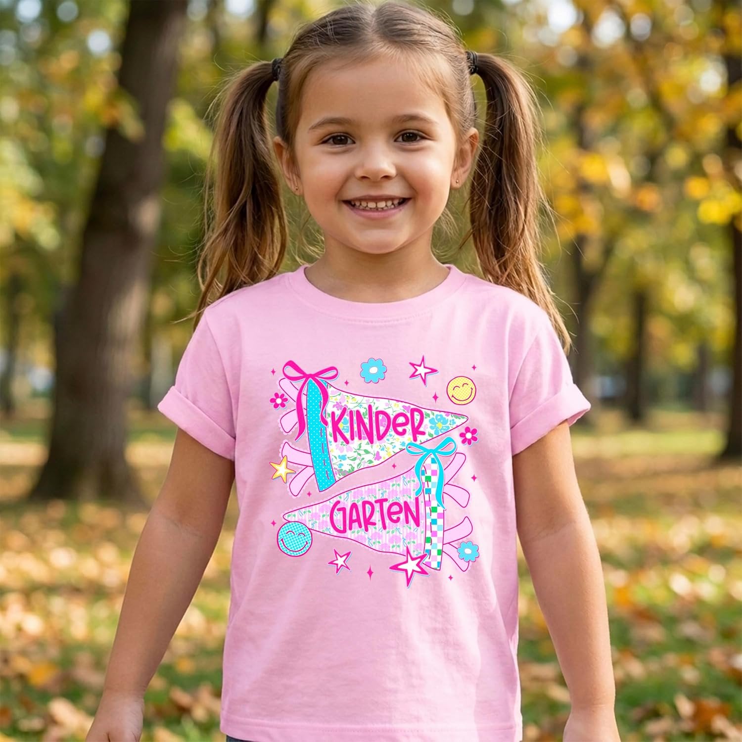 Back-to-school girls graphic tee in natural color with kindergarten pennant design, printed in the USA by Olive Loves Apple