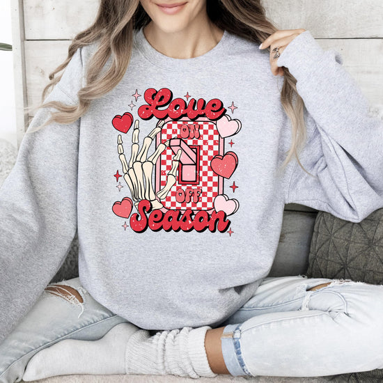Flat lay of Olive Loves Apple Love Season Valentine's graphic sweatshirt showing fabric texture